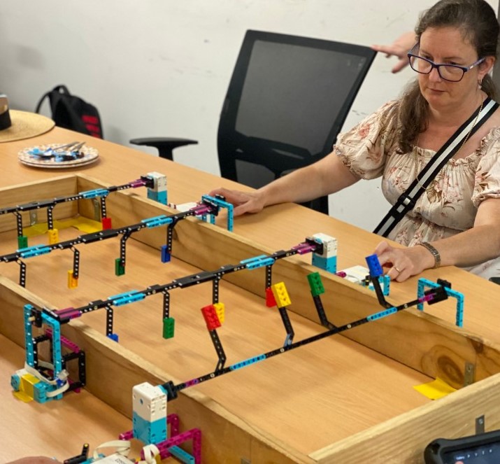 Person using lego robotics in a classroom