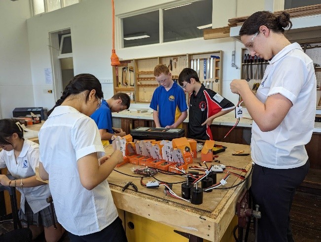 Students learning robotics activities